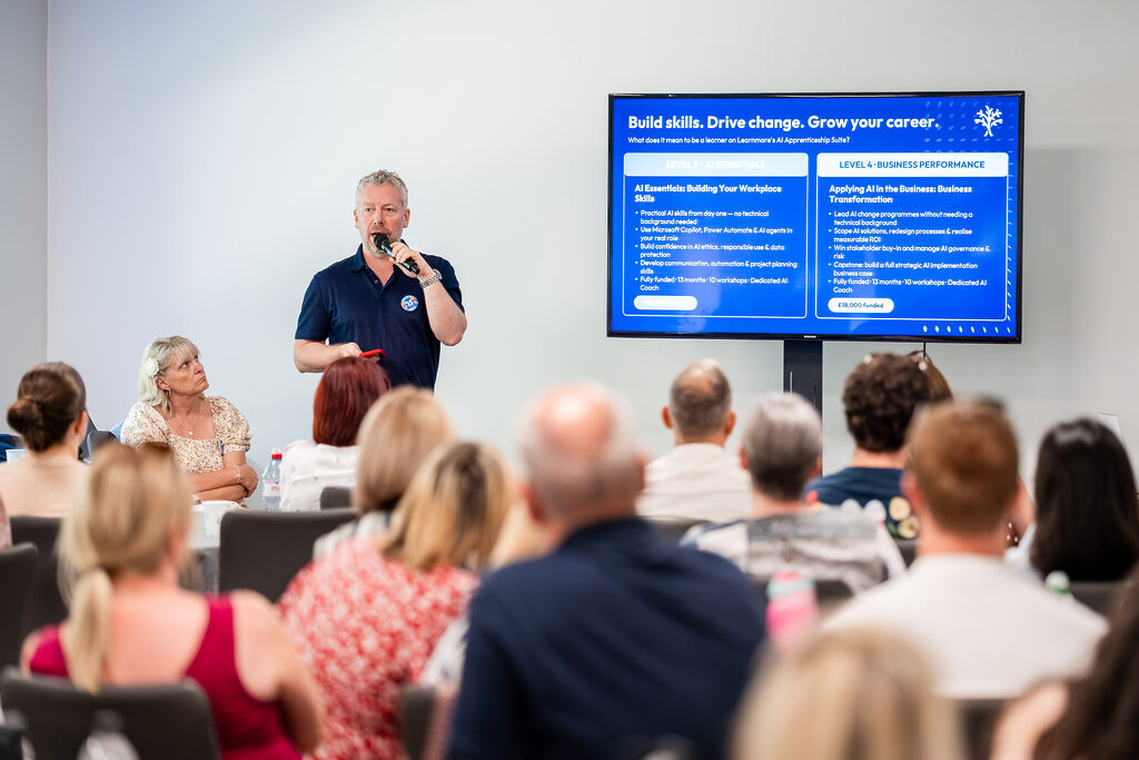 Facilitator presenting to a group of learners in a Learnmore workshop session