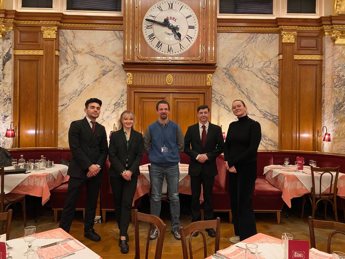 Seb Sokolowski, Learnmore Workplace Coach centre, with from left Simone Sanna, Alona Urushkina, Luke Vargiu and Teodora Pantiru of Brasserie Zédel
